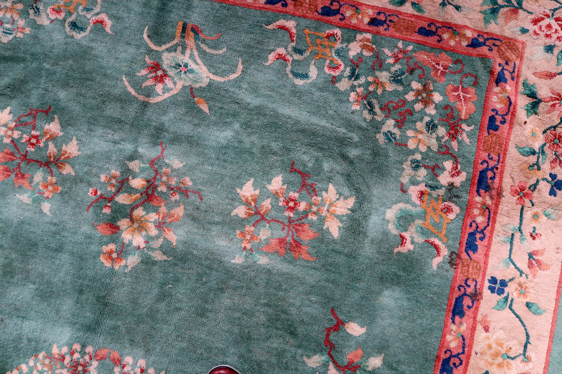 Intricate floral elements on the rug.