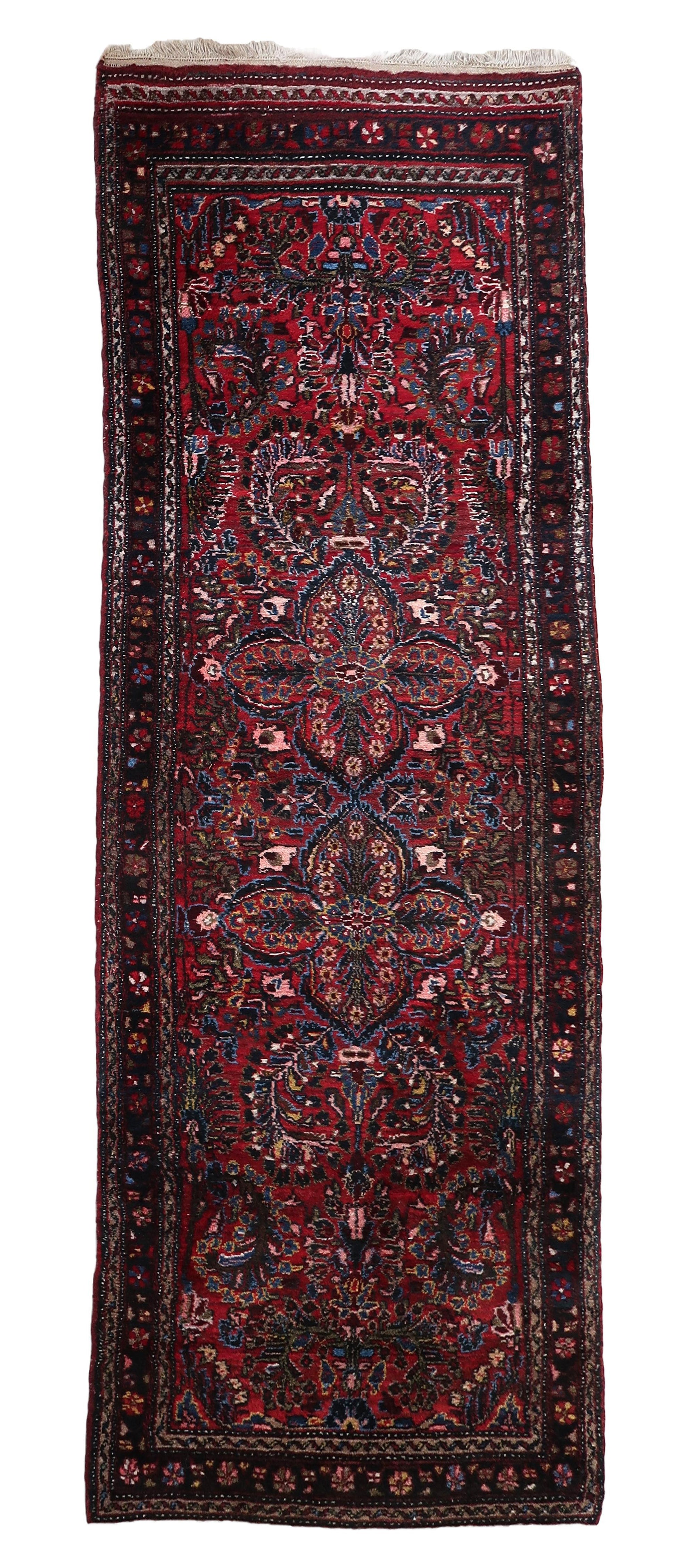 Handmade Vintage Persian Style Sarouk Runner Rug from the 1930s in original good condition.