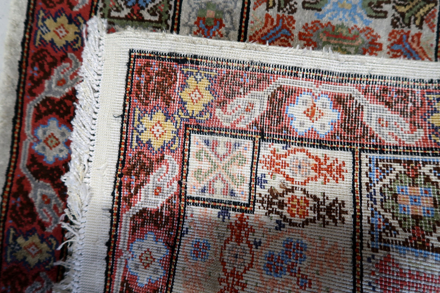 Back view of the vintage Tunisian silk rug highlighting its craftsmanship and size
