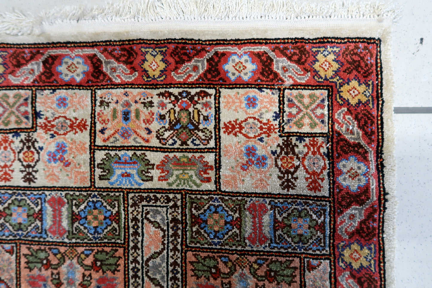 Back view of the vintage Tunisian silk rug highlighting its craftsmanship and size