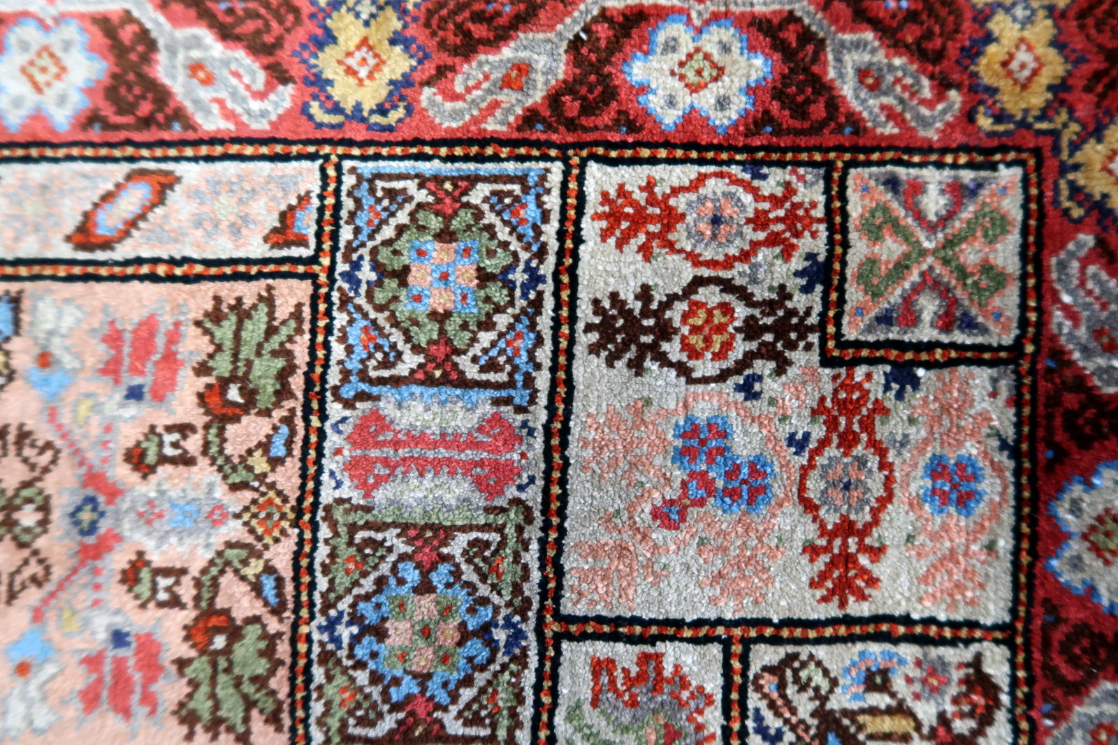 Close-up of the subtle touches of blue and cream accents on the rug's surface