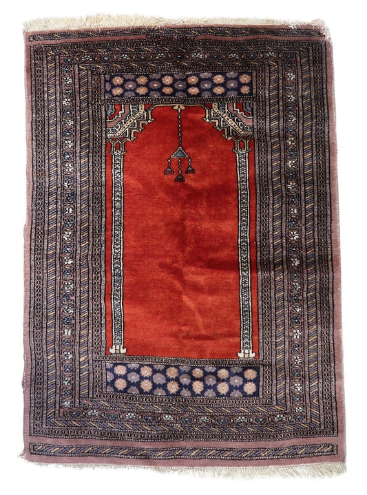 Handmade vintage Pakistani Lahore prayer rug showcasing an elegant arch design and intricate patterns in rich red