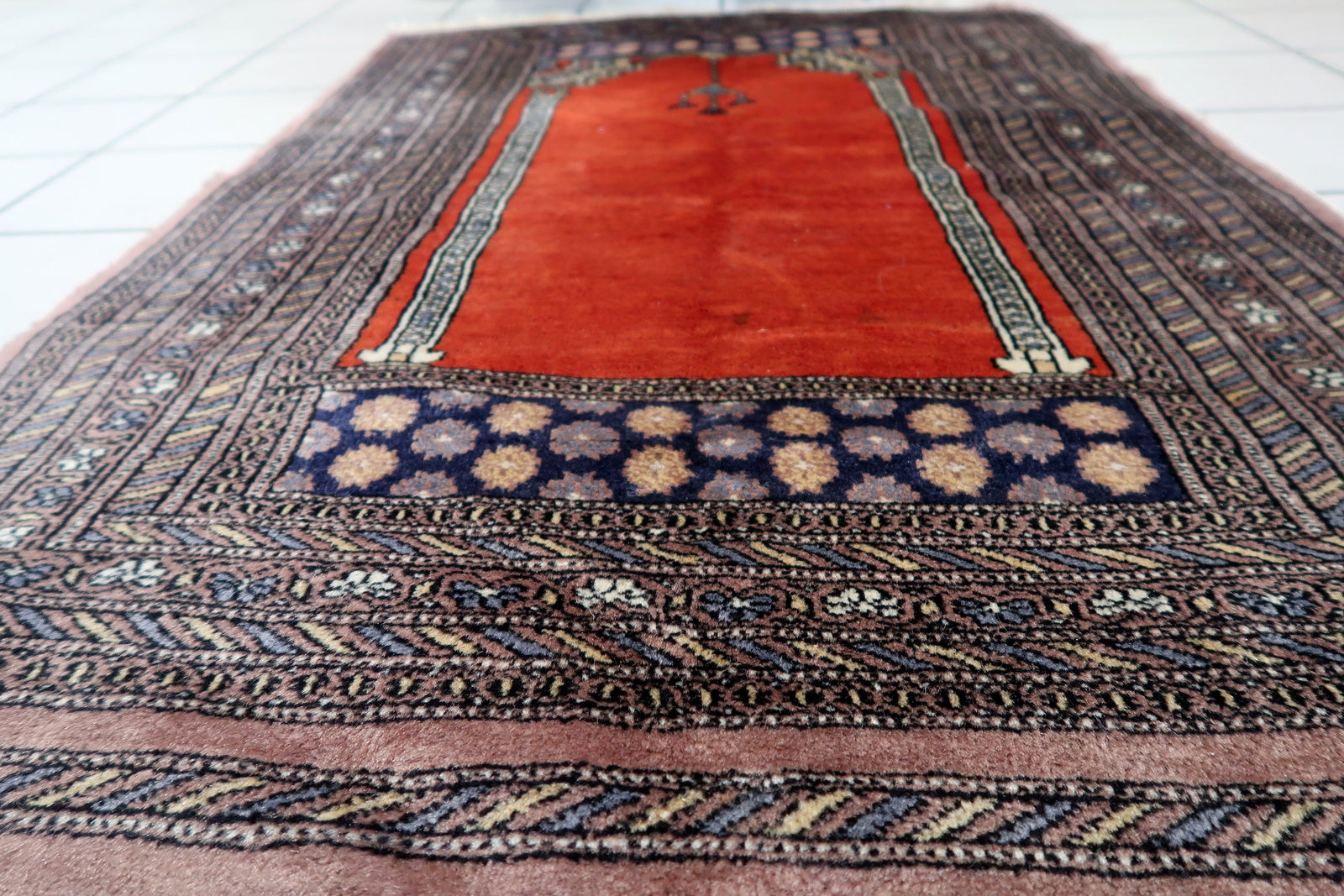 Artistic display of the rug as a decorative accent, adding cultural heritage to any space