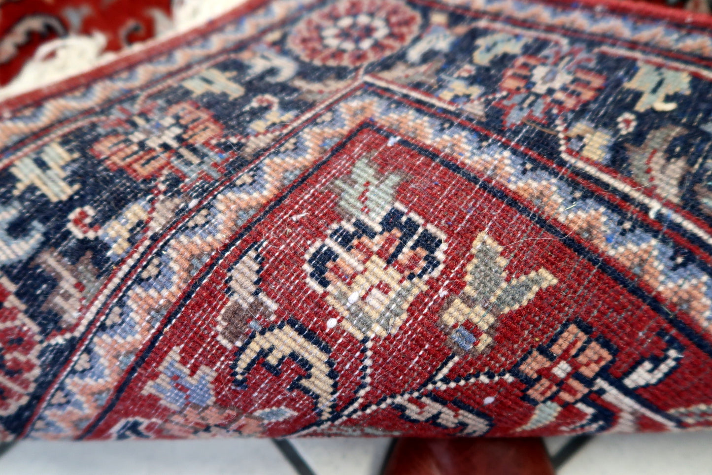 Back view of the vintage Persian style Sarouk rug highlighting its craftsmanship and size