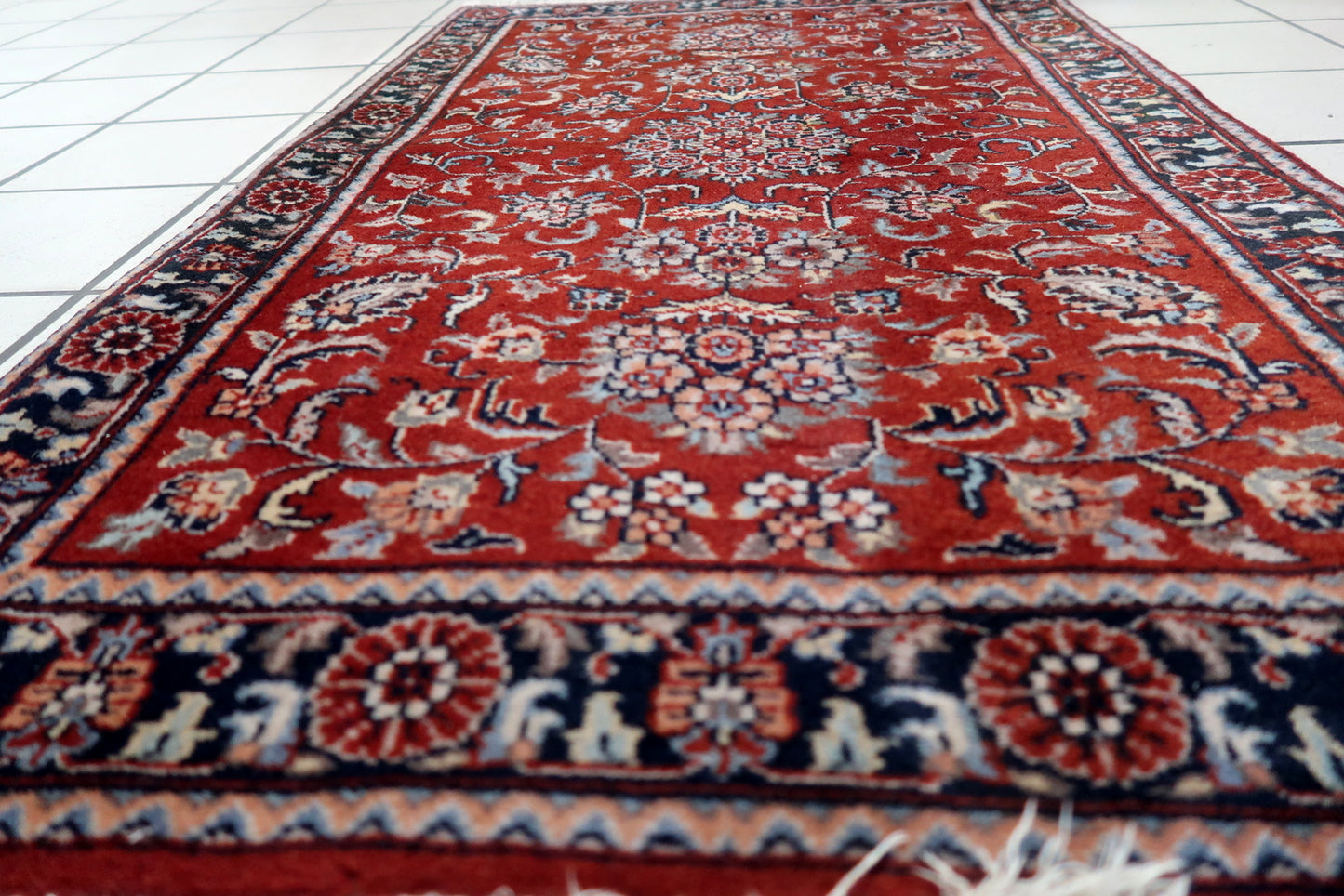 Front view of the handmade Persian style Sarouk rug enhancing the ambiance of a cozy corner
