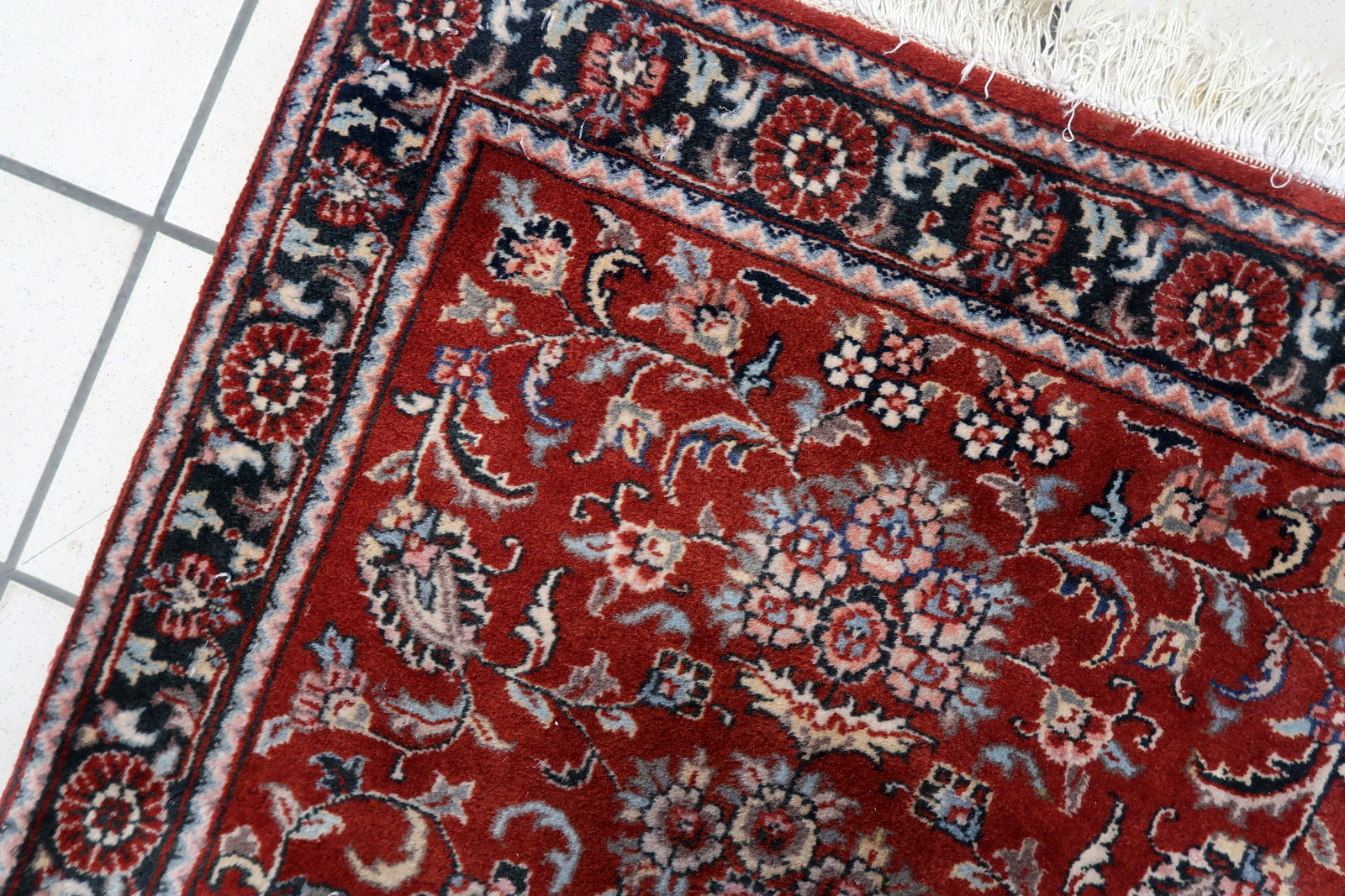 Side view of the small rectangular rug made from durable wool fibers