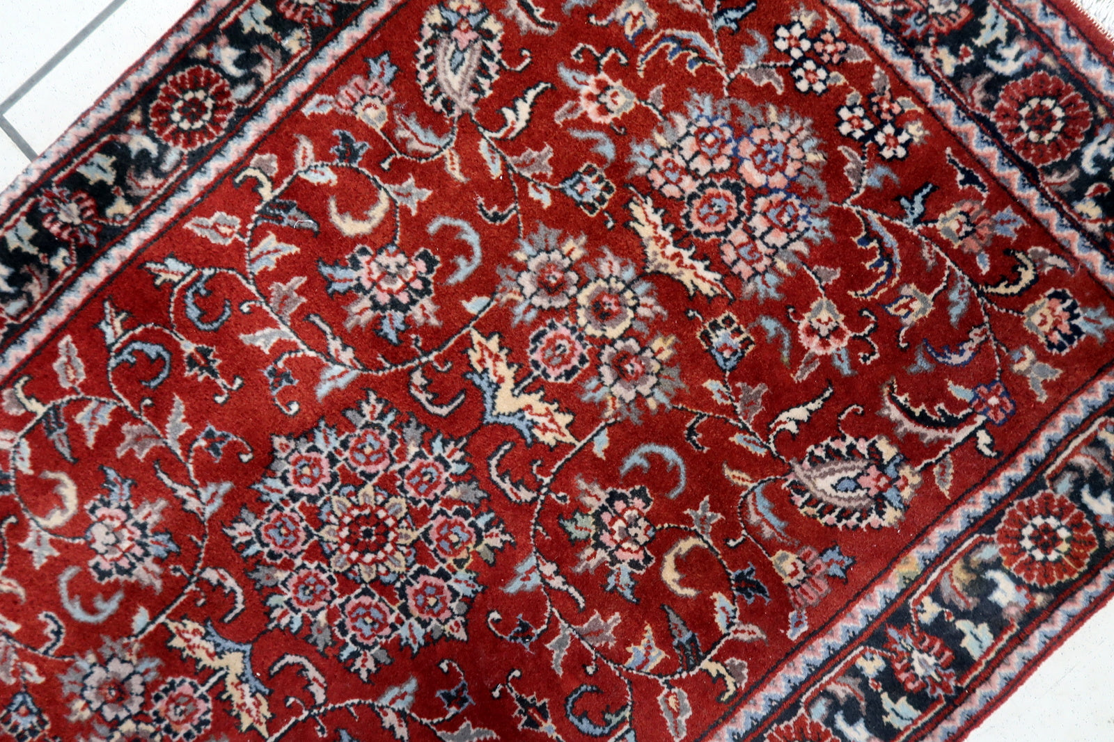 Overhead shot of the Persian style Sarouk rug displaying its warm and inviting ambiance