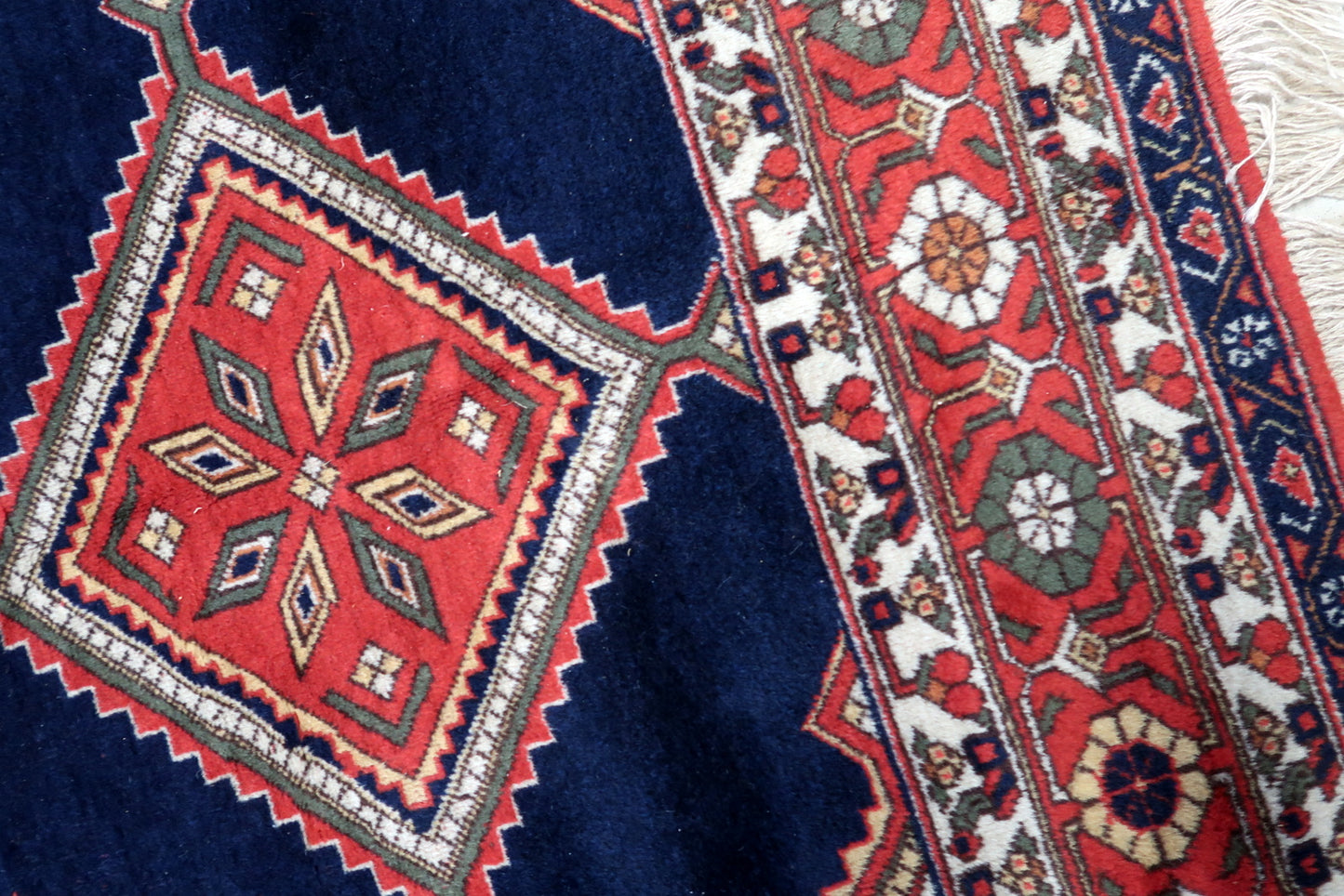 Side view of the large rectangular rug made from durable wool fibers
