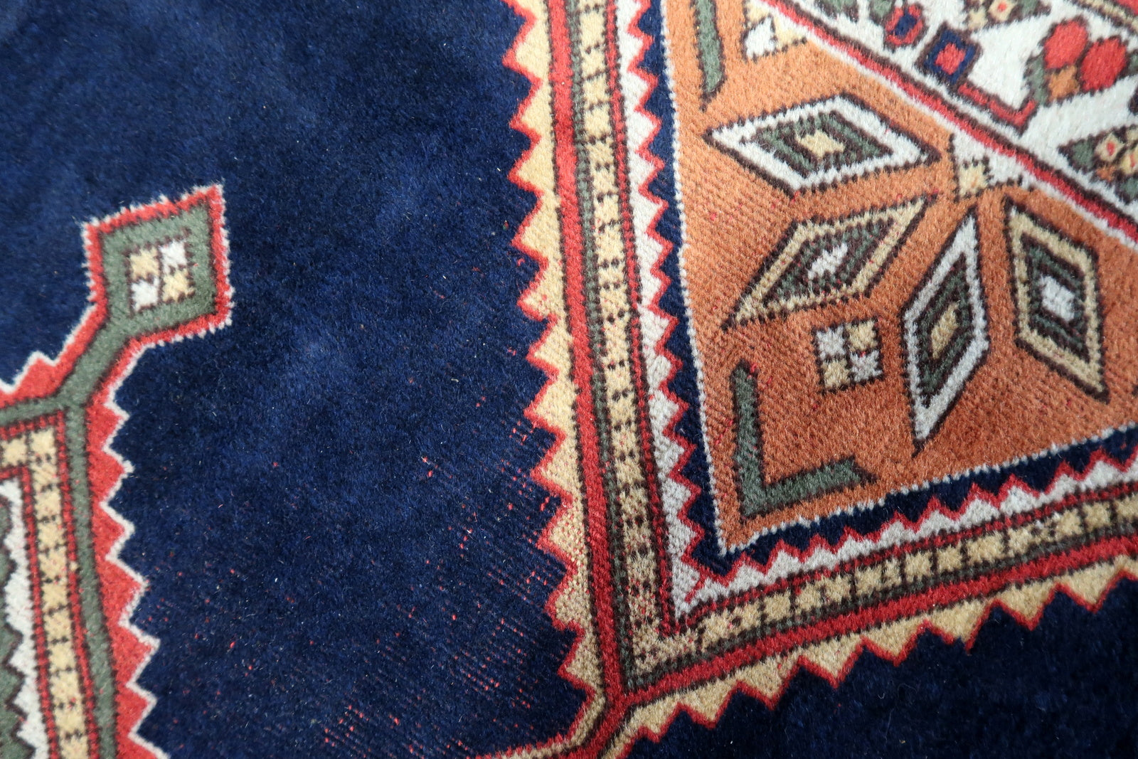 Front view of the handmade Persian style Afshar rug enhancing the ambiance of a living room