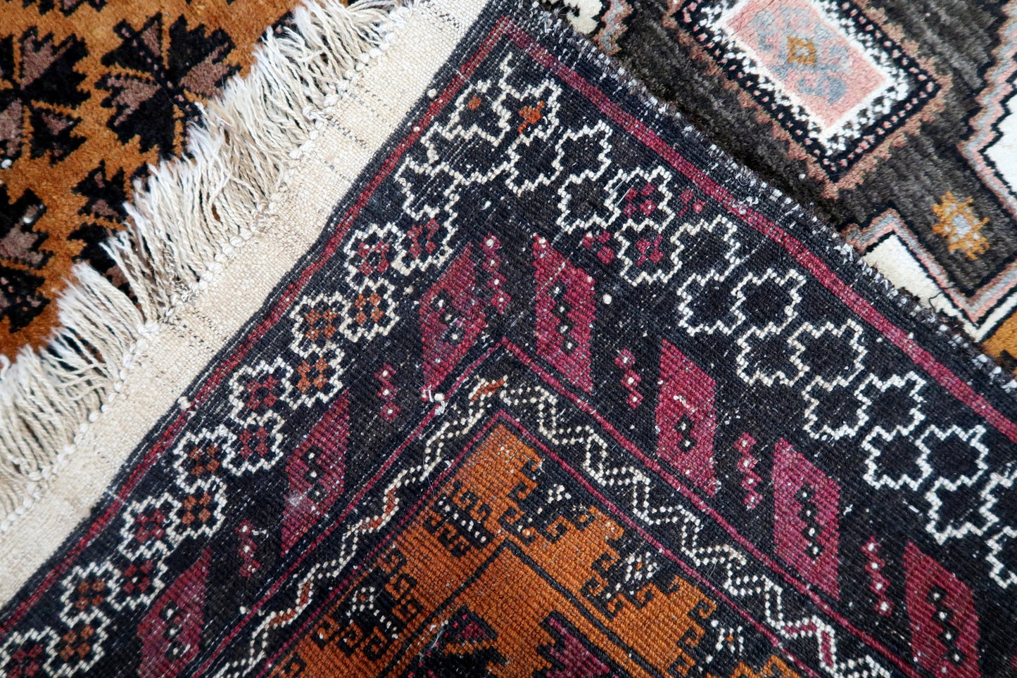 Back view of the vintage Afghan Baluch rug highlighting its craftsmanship and size
