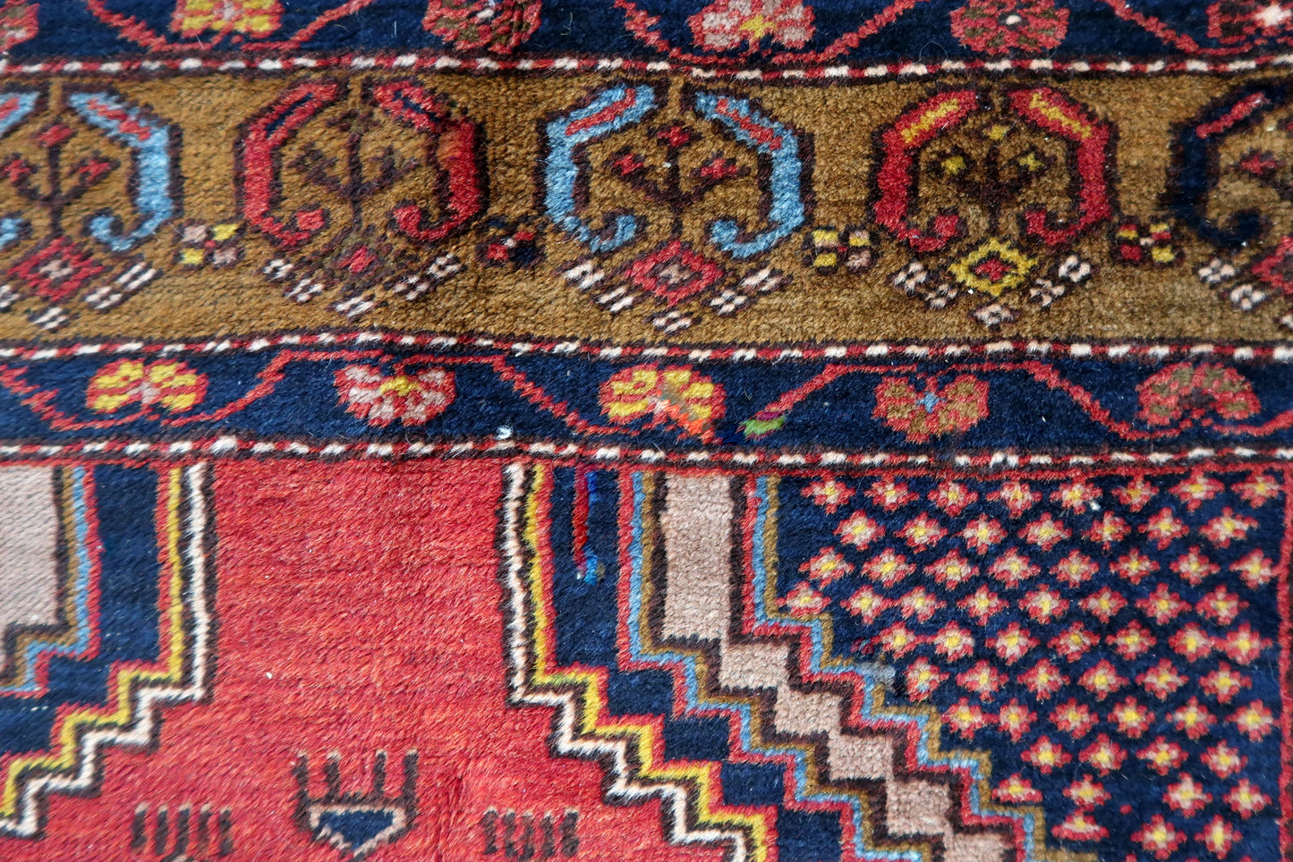 Side angle view of the rug, highlighting its thickness and plush texture
