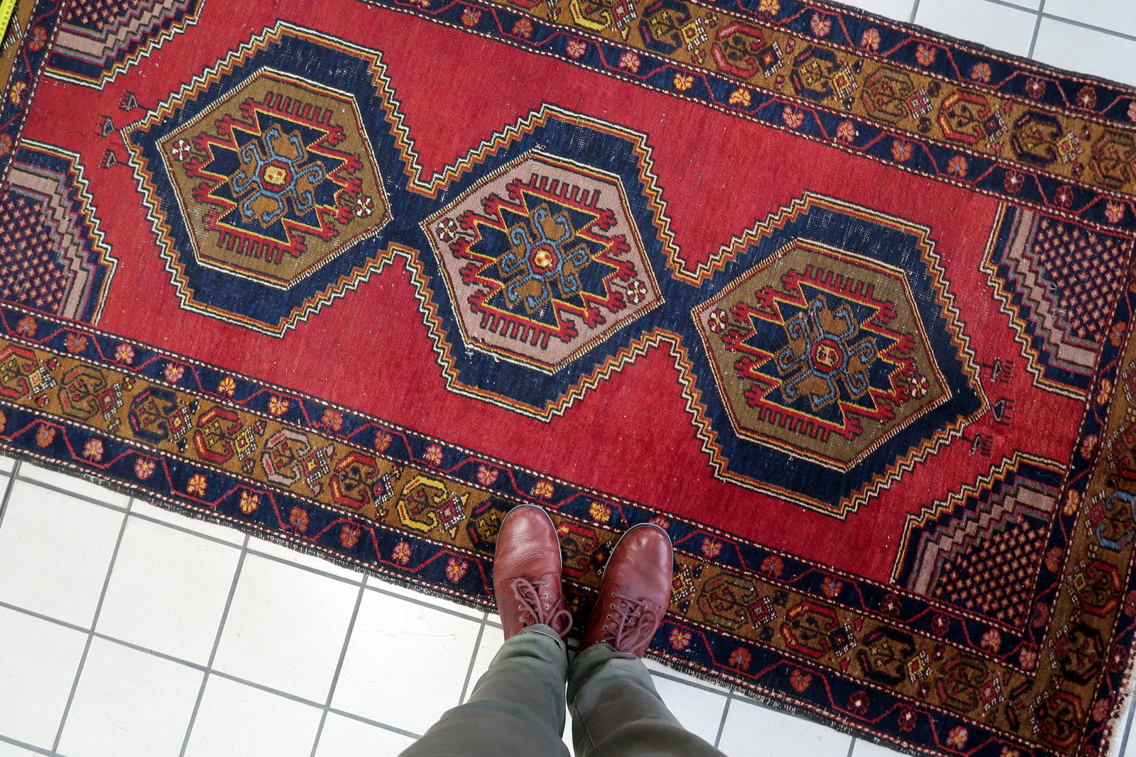 Close-up of the intricate patterns on one side of the rug's border