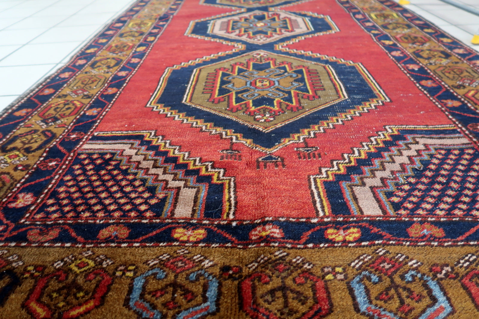 Artistic display of the rug as a focal point in a study, showcasing its vintage allure