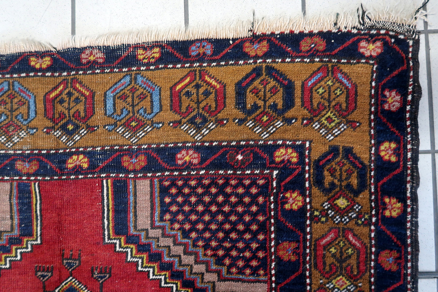Overhead shot of the Turkish Anatolian rug displaying its detailed center geometric shapes