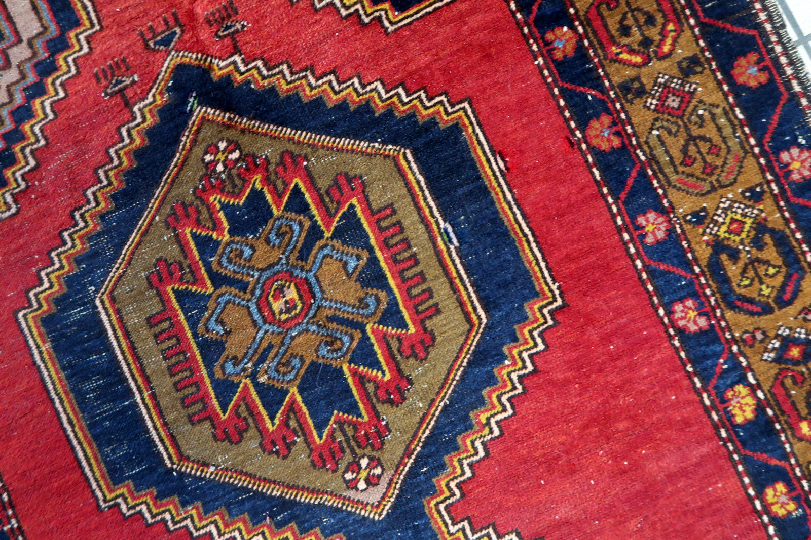Artistic display of the rug as a focal point in a study, showcasing its vintage allure