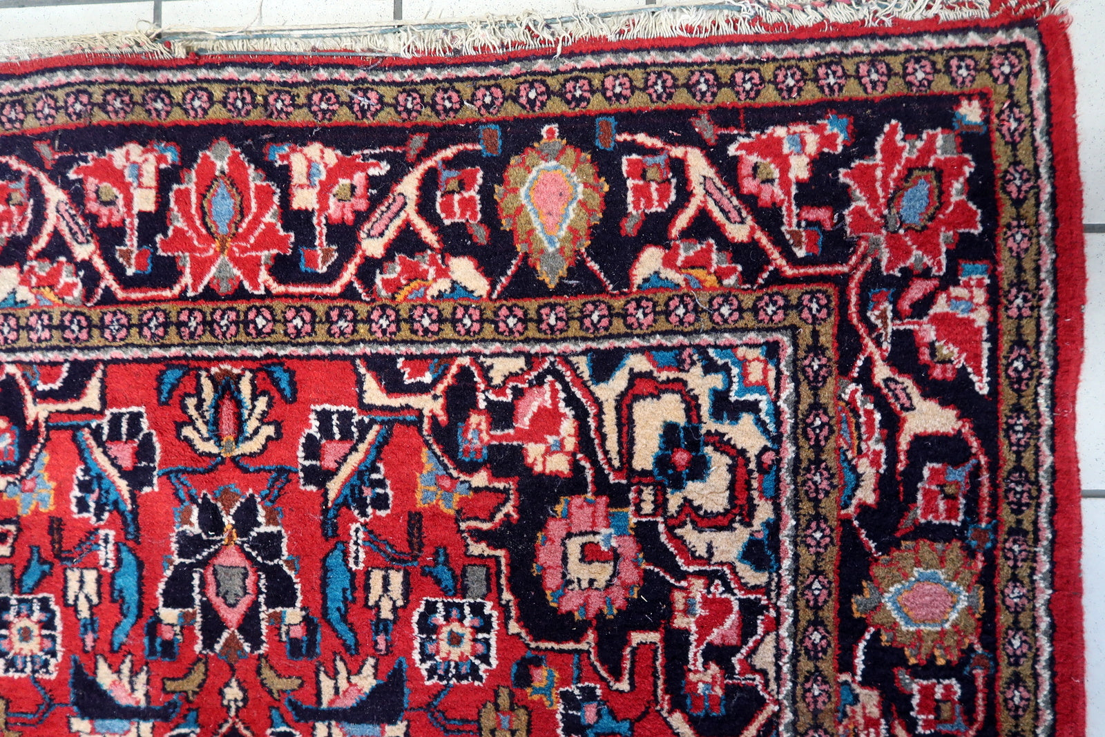 Overhead shot of the Persian Kashan rug displaying its detailed center geometric shapes