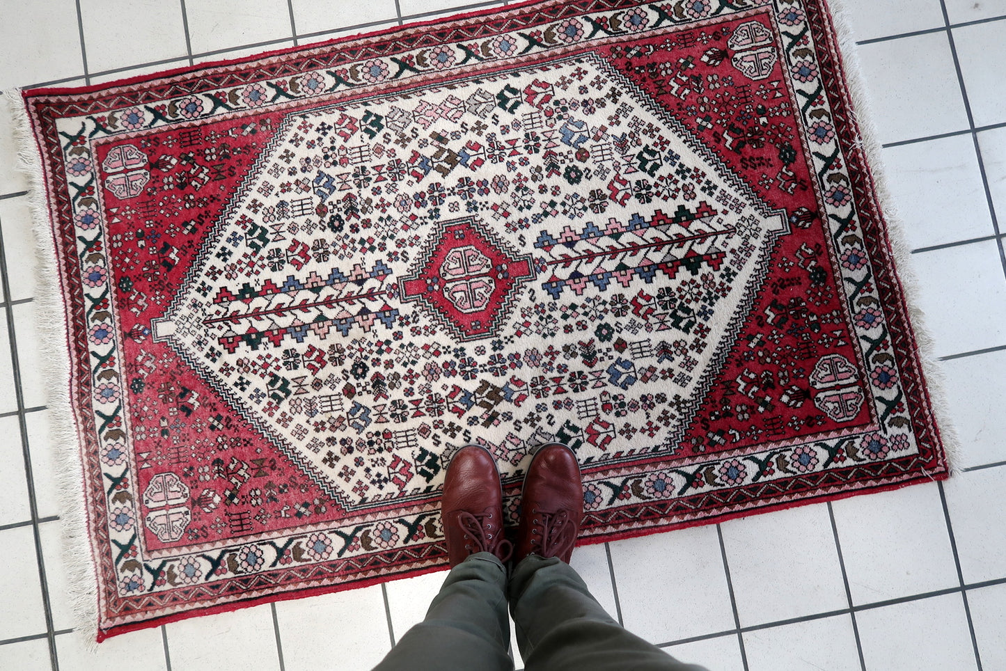 Side angle view of the rug, highlighting its thickness and plush texture