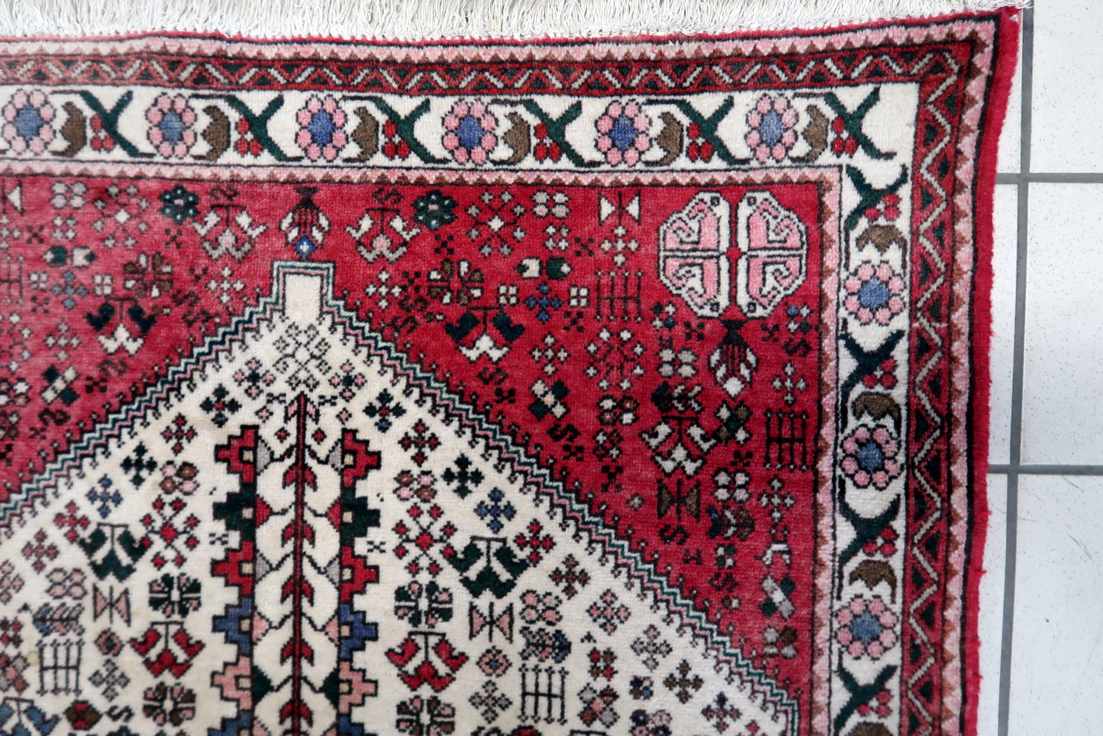Close-up of the central part of the rug displaying an elaborate geometric design