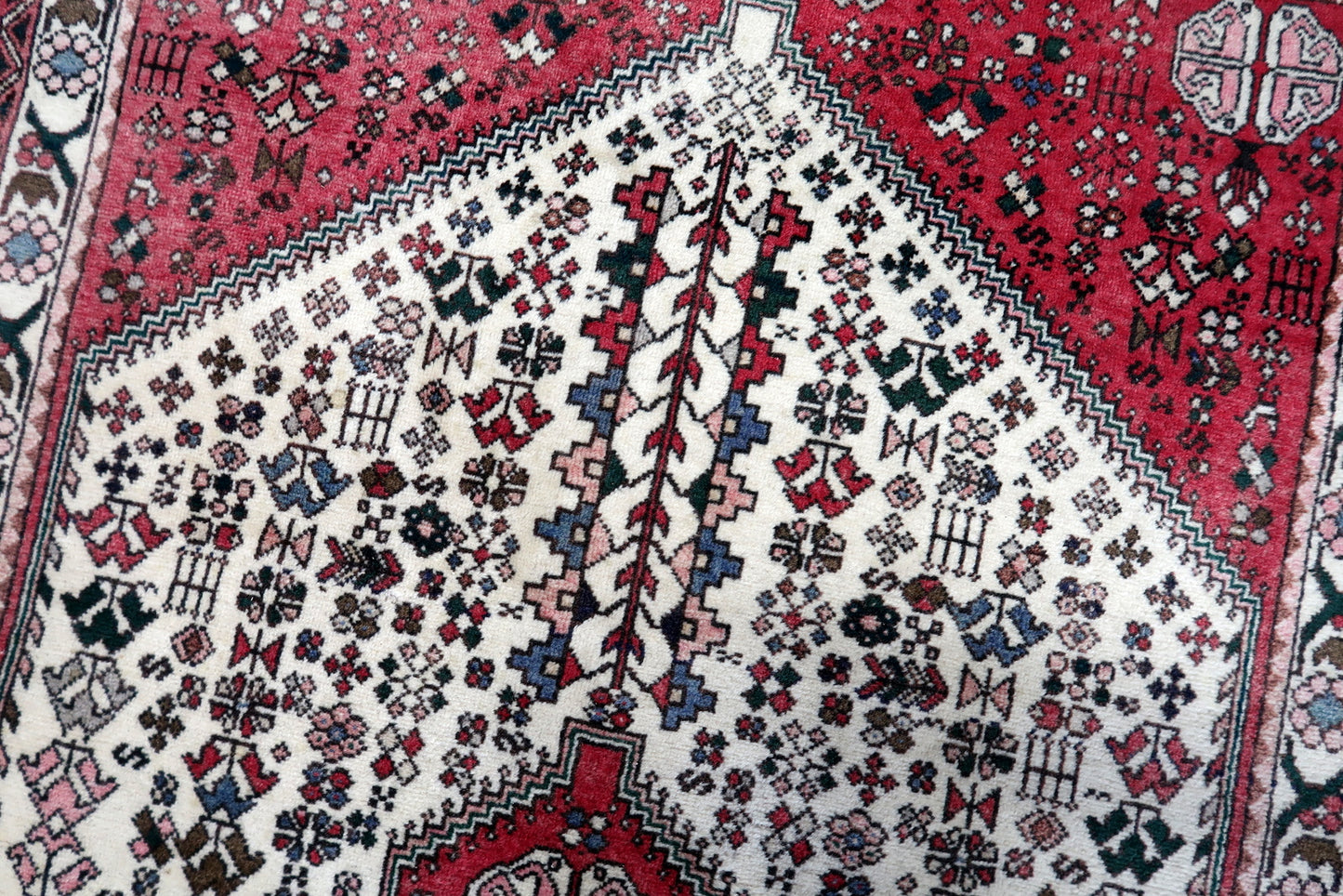 Close-up of the intricate geometric design in the central part of the rug
