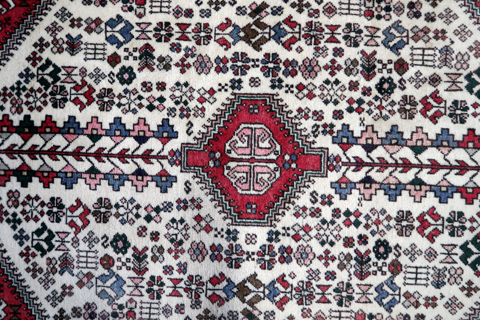 Detailed view of the black and blue accents complementing the dominant red hue