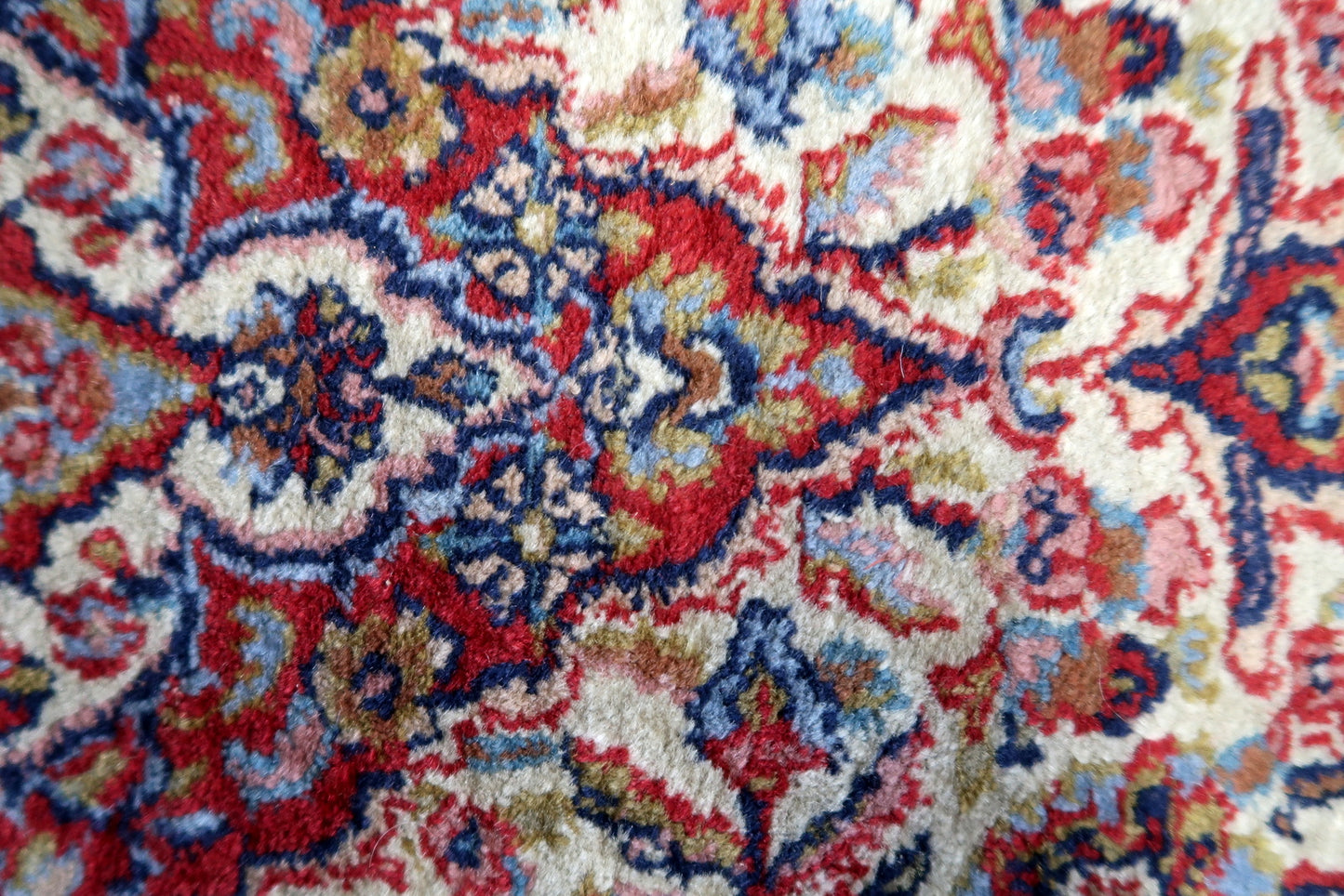 Close-up of the rug's corner, showcasing the intricate craftsmanship
