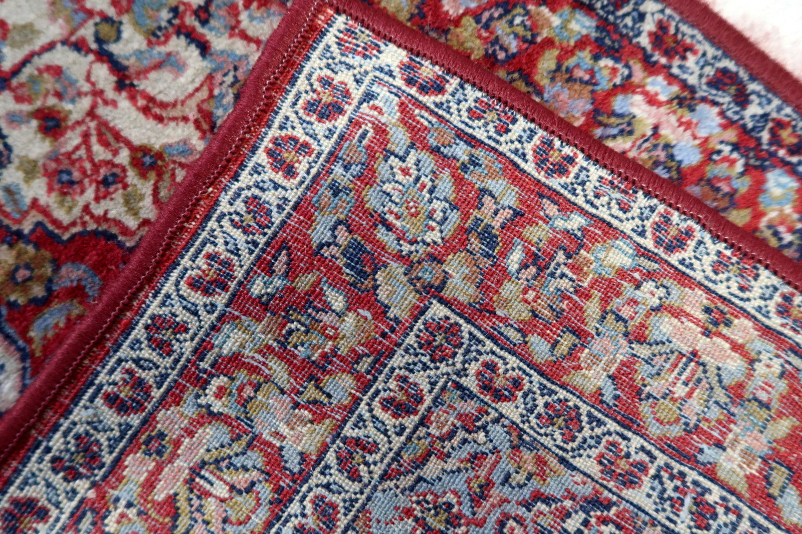 Back view of the vintage Indian rug highlighting its craftsmanship and size