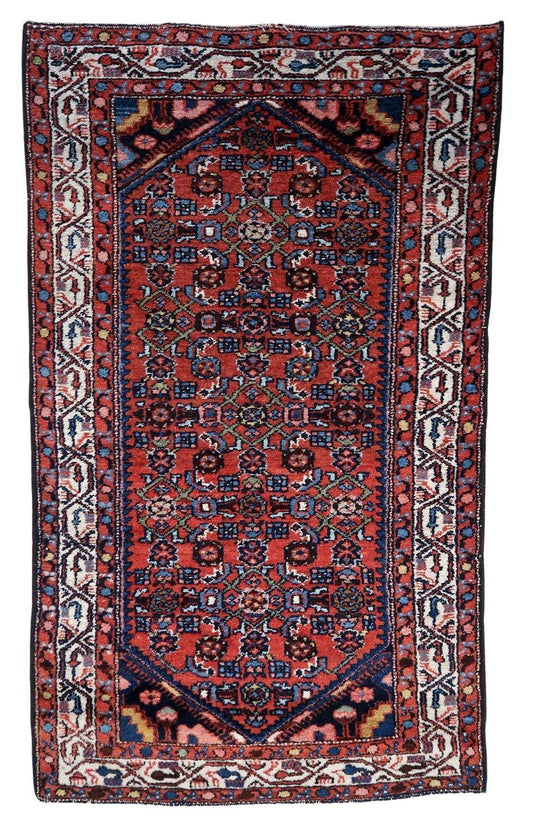 Handmade Vintage Persian Hamadan rug showcasing dominant red hue with intricate geometric motifs