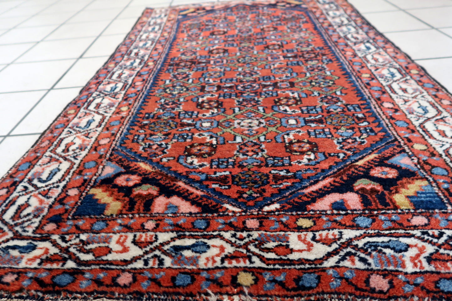 Side angle view of the rug, highlighting its thickness and plush texture