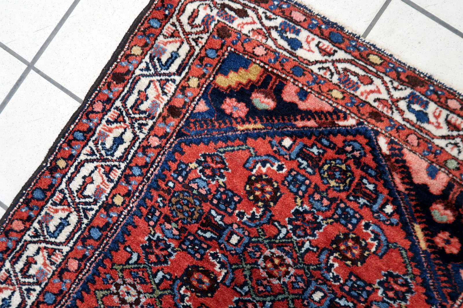Side view of the small rectangular rug made from high-quality wool fibers