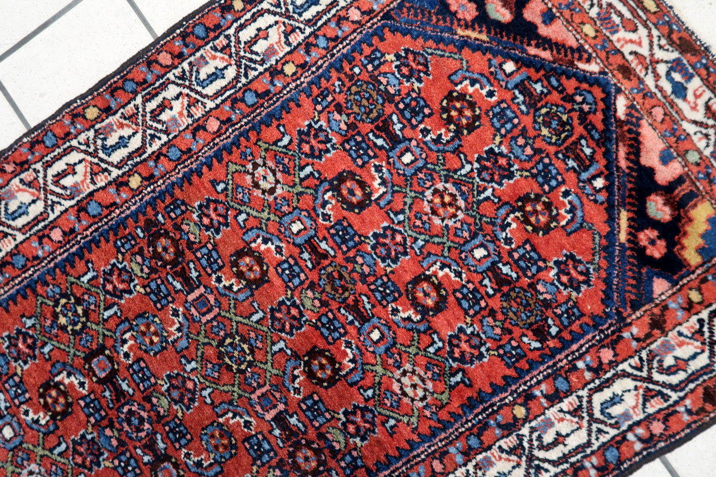 Overhead shot of the Hamadan rug displaying its rich color palette and detailed patterns