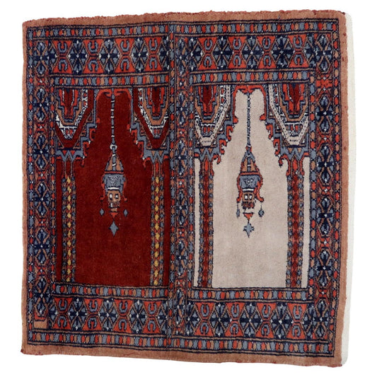 Handmade Vintage Pakistani Lahore Prayer Rug showcasing intricate arch-shaped motifs in deep reds and blues with creamy white fringes