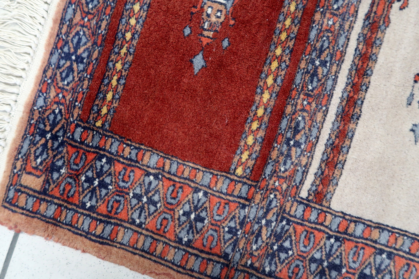 Side angle view of the rug, showcasing its compact yet impactful size and square shape