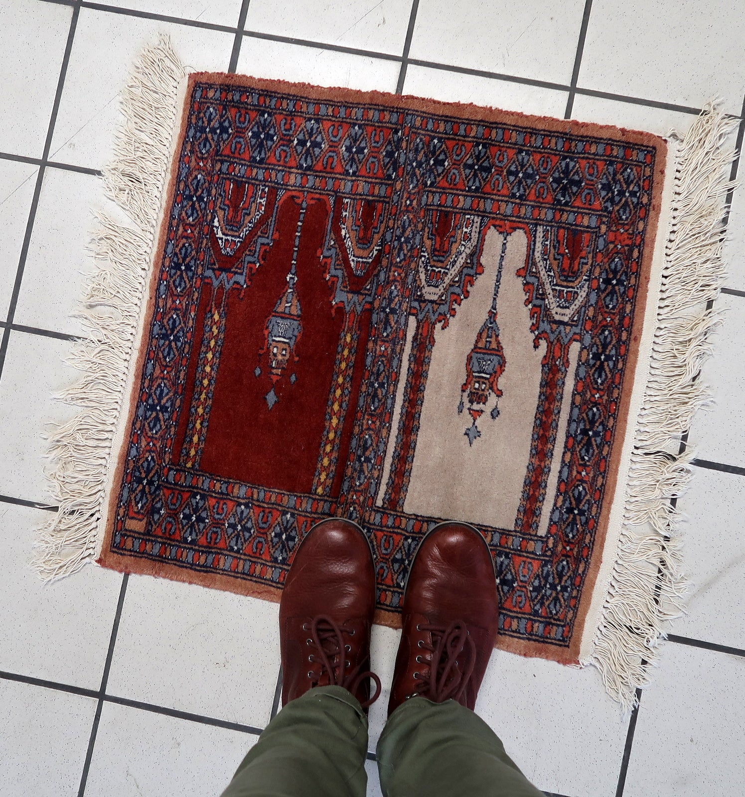 Front view of the rug draped elegantly on the floor, capturing its full dimensions and design