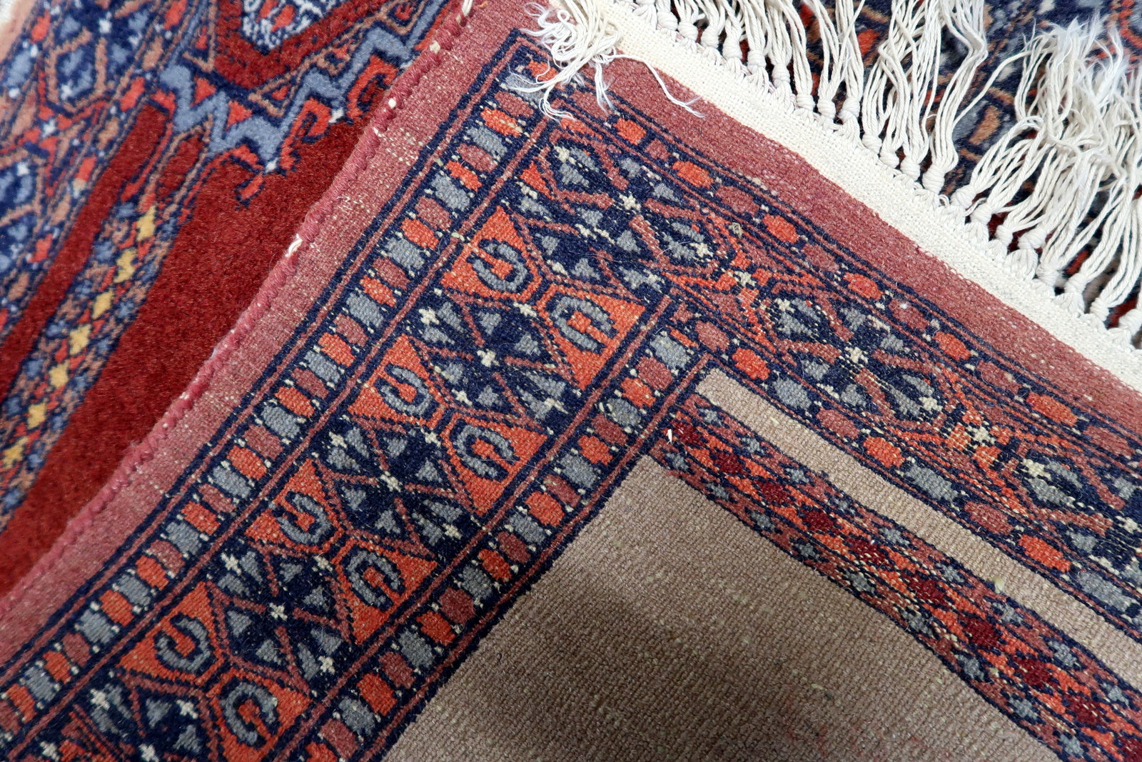 Back view of the rug highlighting its construction and dimensions