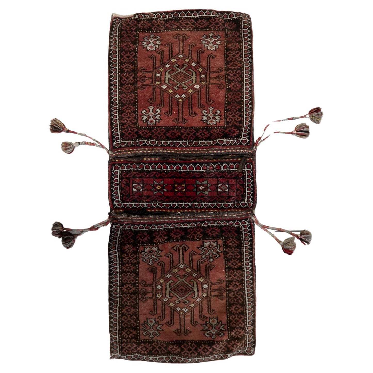 Handmade Antique Afghan Baluch Saddle Bag showcasing intricate woven patterns in deep reds, browns, and beige