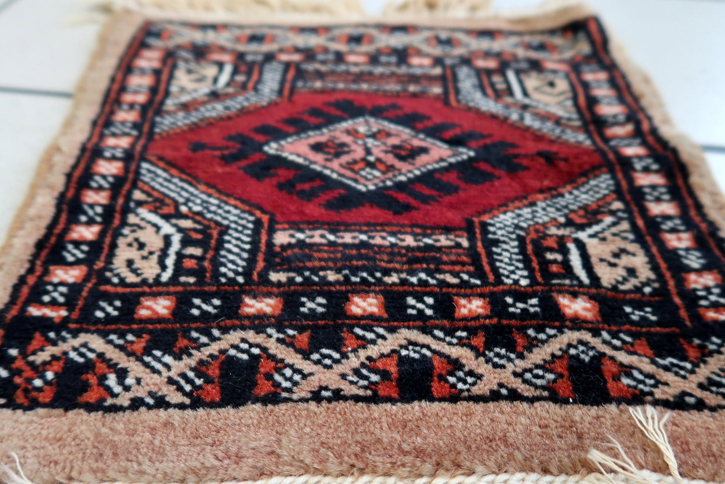 Front view of the mat rug hanging elegantly, capturing its full dimensions and design