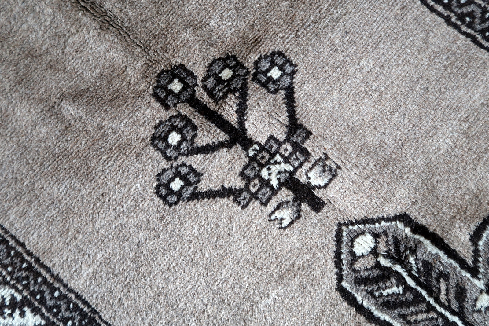 Prominent Central Motif Showcasing Traditional Patterns and Symbols on Vintage Persian Gabbeh Rug - 1970s