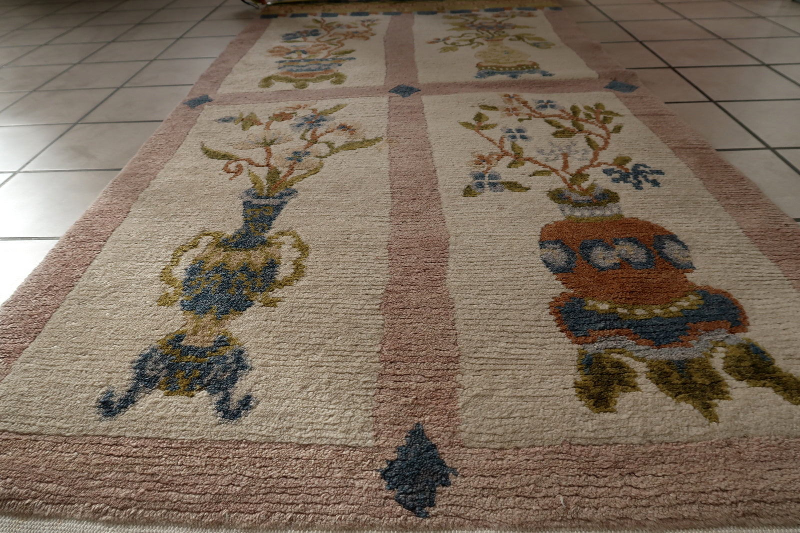 Base Color of Rug in Off-White or Beige, with Decorative Elements in Blues, Reds, Greens, and Browns - 1970s