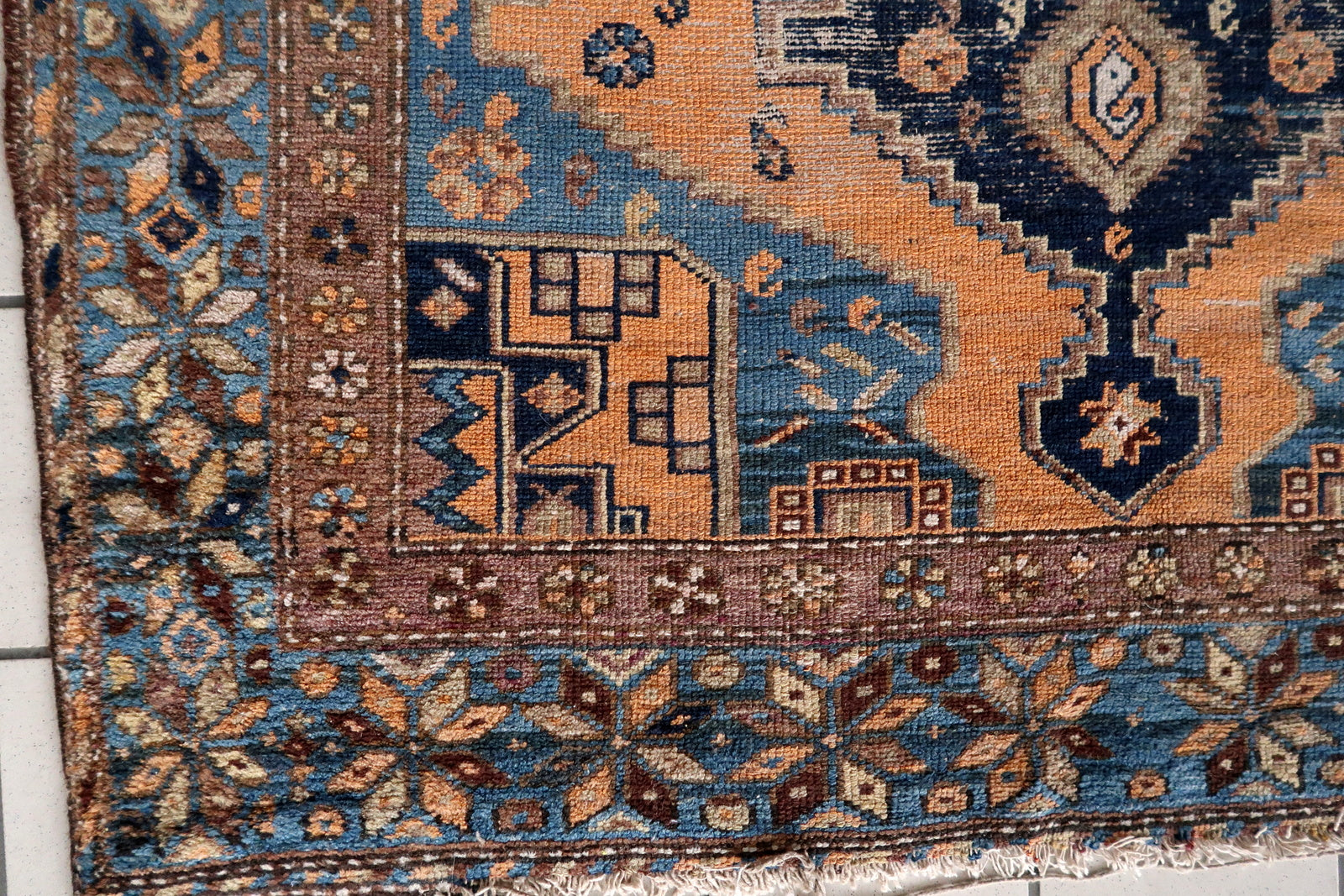 Close-up of intricate design on Handmade Antique Caucasian Shirvan Rug - Detailed view highlighting the geometric motifs and traditional symbols.