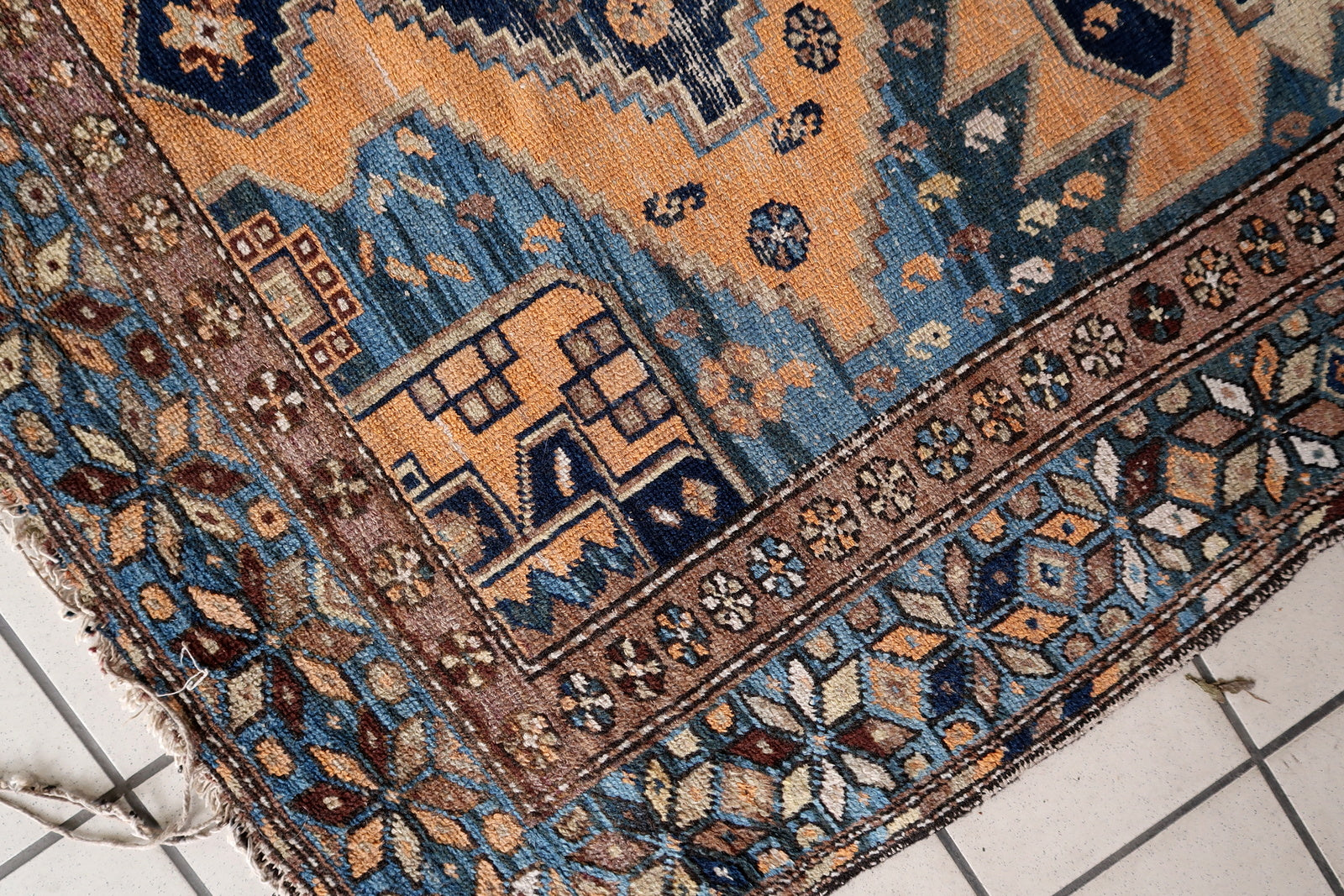 Close-up of rugged beauty on Handmade Antique Caucasian Shirvan Rug - Detailed view capturing the rugged beauty evoked by the color palette.