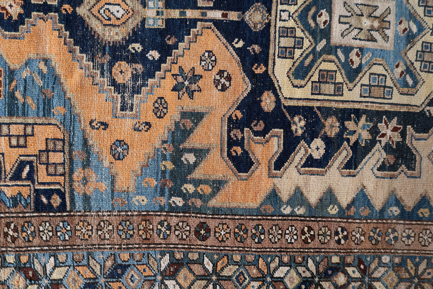 Close-up of rugged beauty on Handmade Antique Caucasian Shirvan Rug - Detailed view capturing the rugged beauty evoked by the color palette.