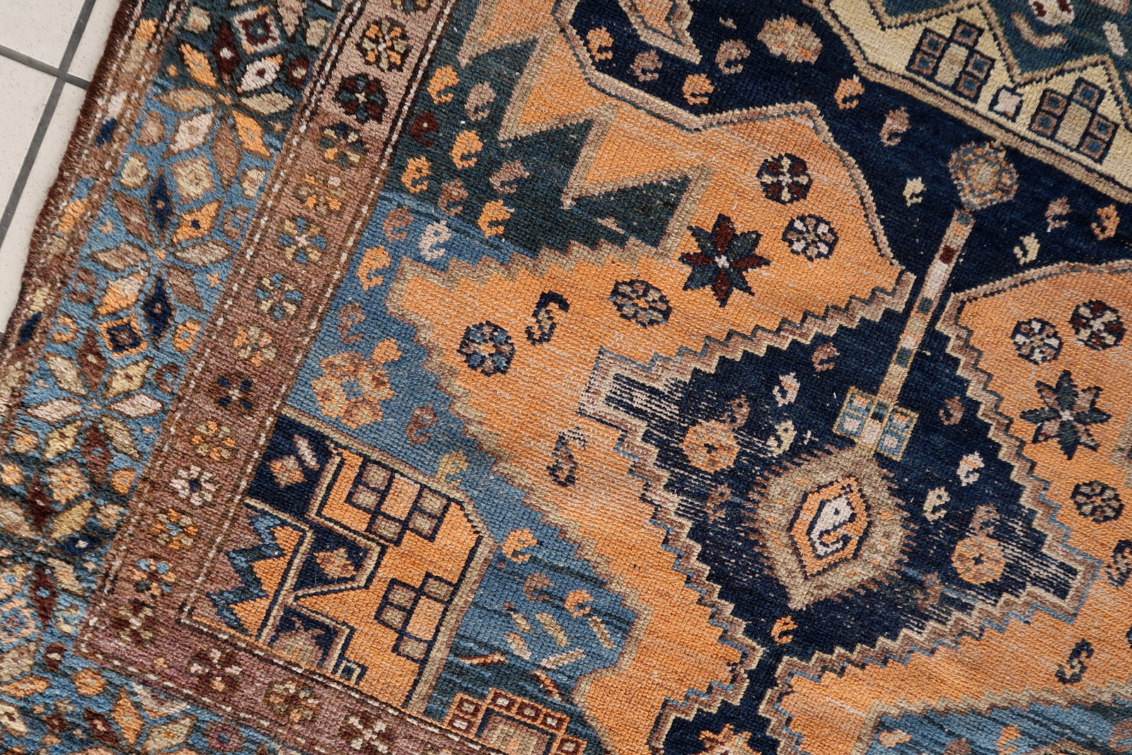 Close-up of distressed appearance on Handmade Antique Caucasian Shirvan Rug - Detailed view emphasizing the distressed appearance that adds character to the rug.