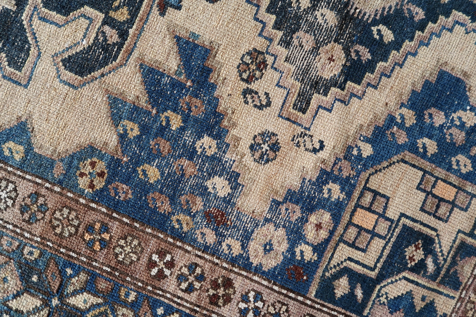 Close-up of versatile placement on Handmade Antique Caucasian Shirvan Rug - Detailed view demonstrating the rug's versatility in various settings.