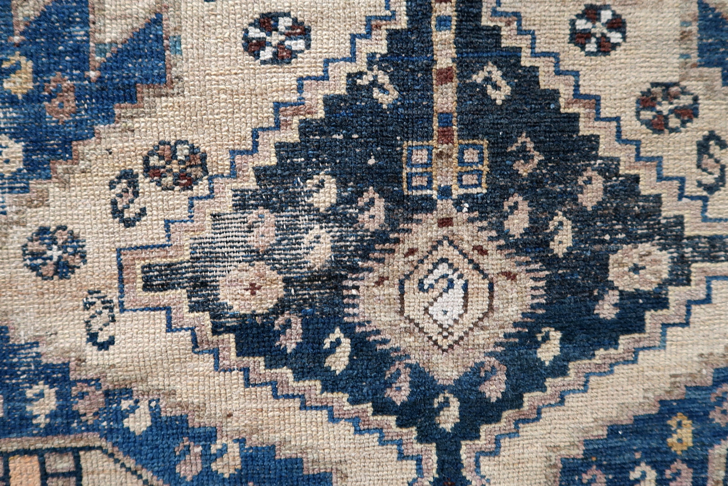 Close-up of compact size on Handmade Antique Caucasian Shirvan Rug - Detailed view highlighting the compact yet impactful size of the rug.