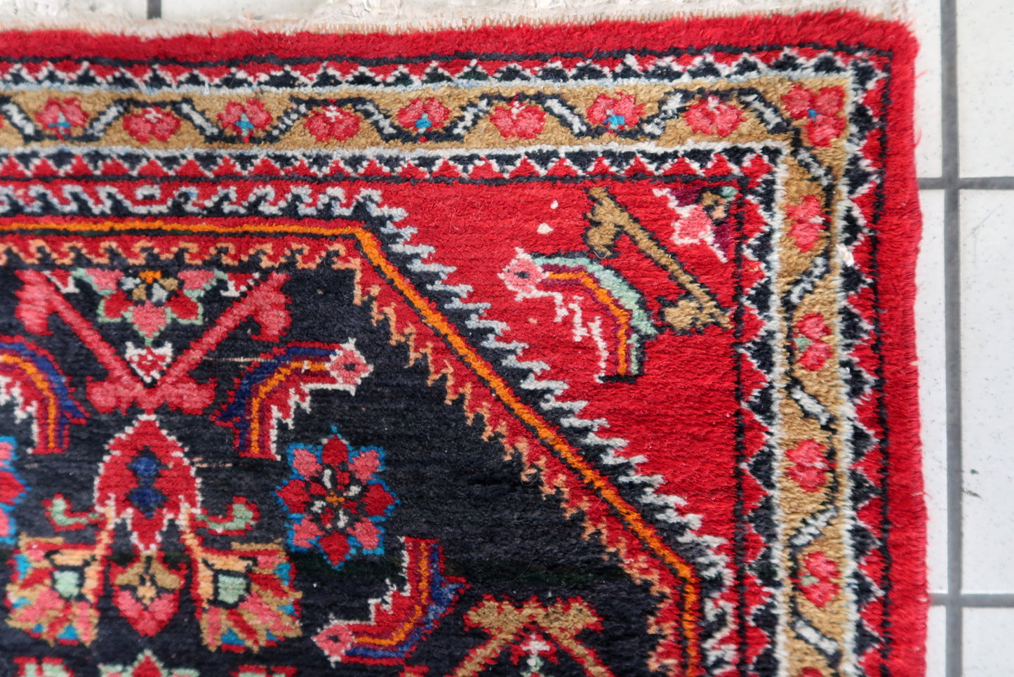 Close-up of vintage charm on Handmade Vintage Persian Hamadan Rug - Detailed view showcasing the rug's vintage appeal.