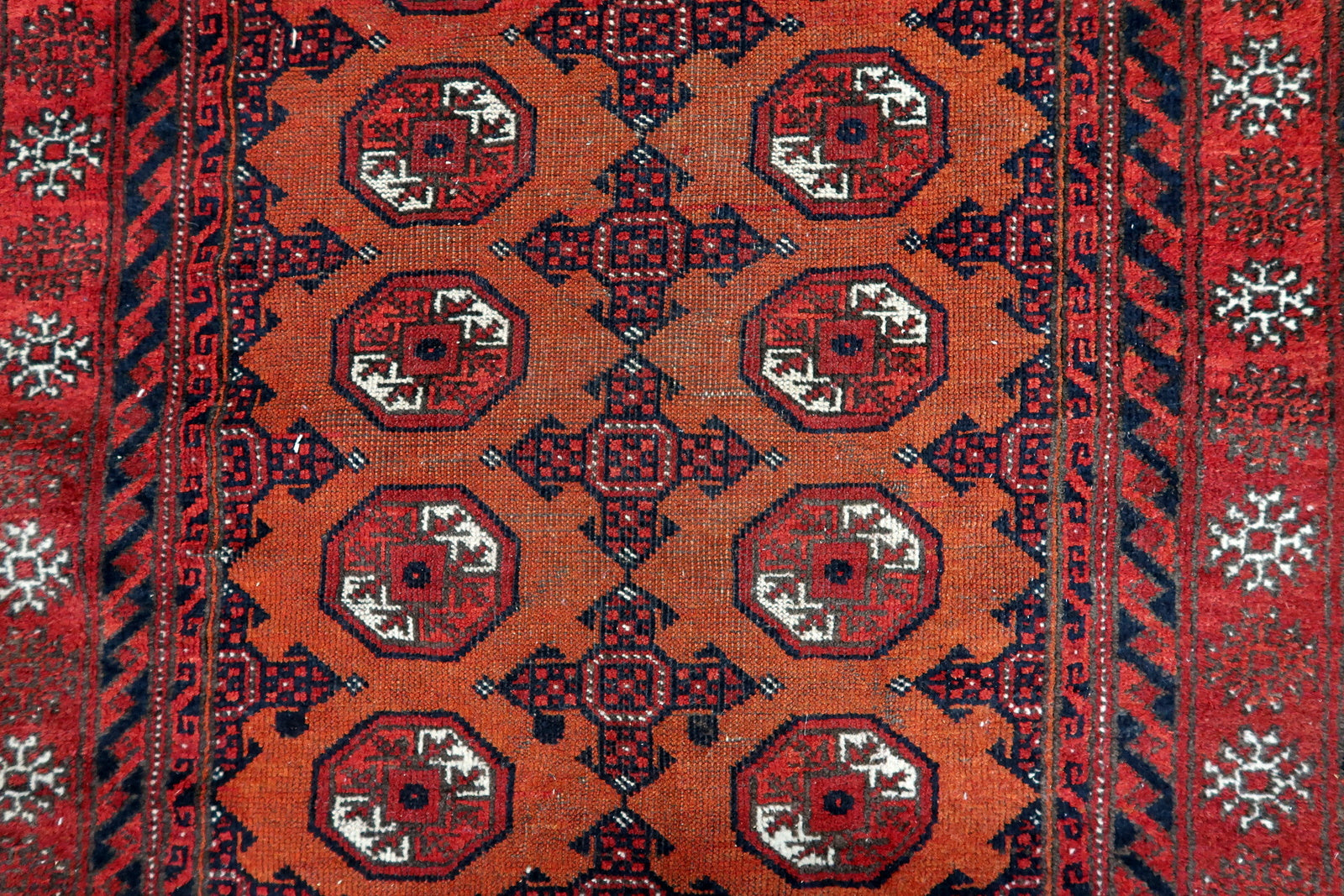 Close-up of wool material on Handmade Antique Afghan Baluch Rug - Detailed view showcasing the wool material known for its durability and softness.