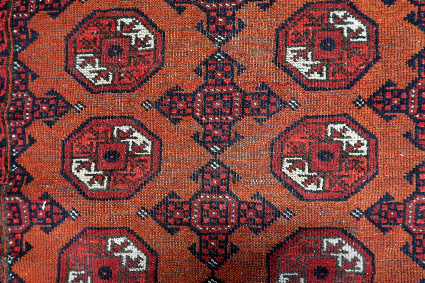 Close-up of wear and tear on Handmade Antique Afghan Baluch Rug - Detailed view highlighting the wear over time, contributing to the rug's character.