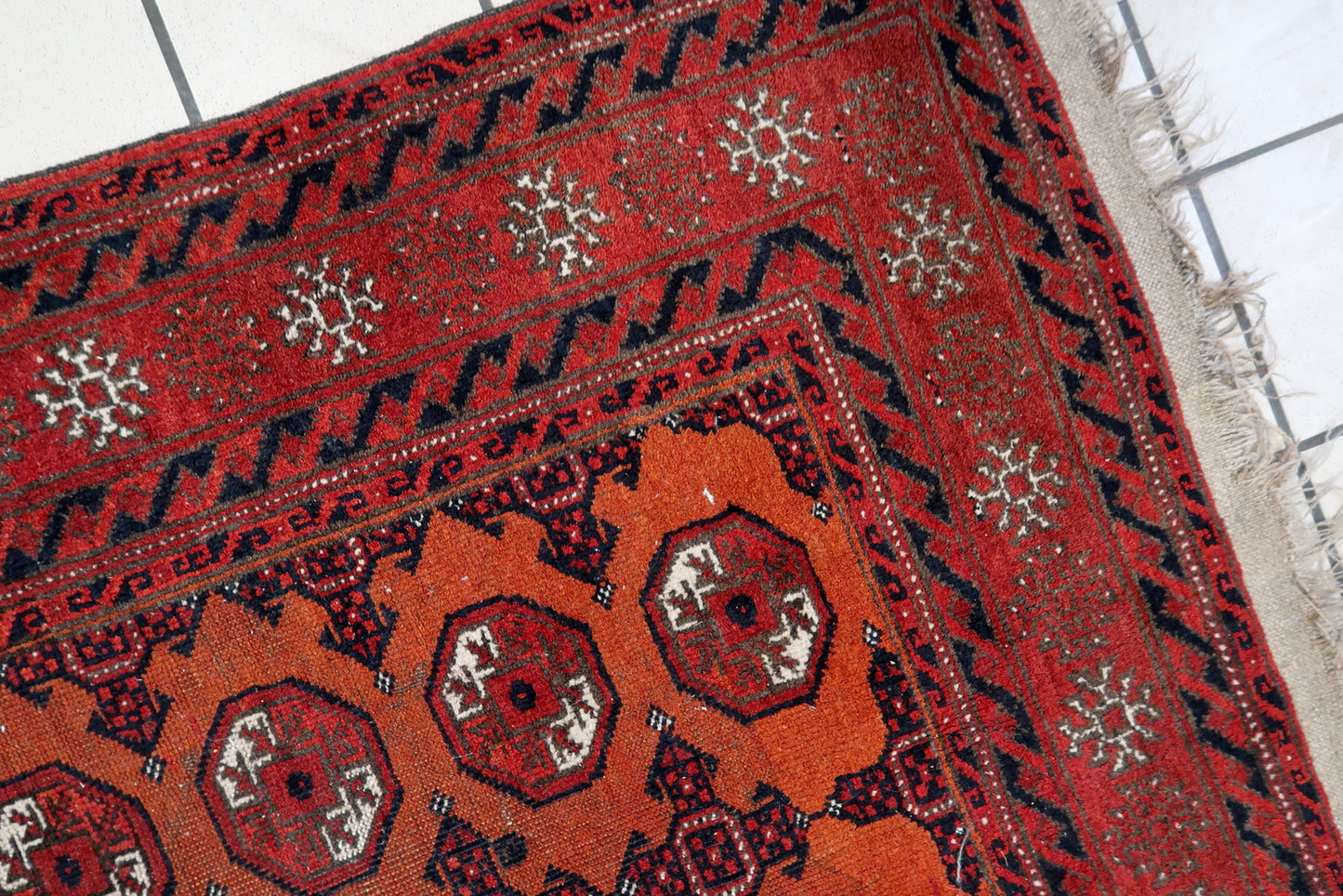 Close-up of compact size on Handmade Antique Afghan Baluch Rug - Detailed view showcasing the rug's compact size, suitable for various spaces.