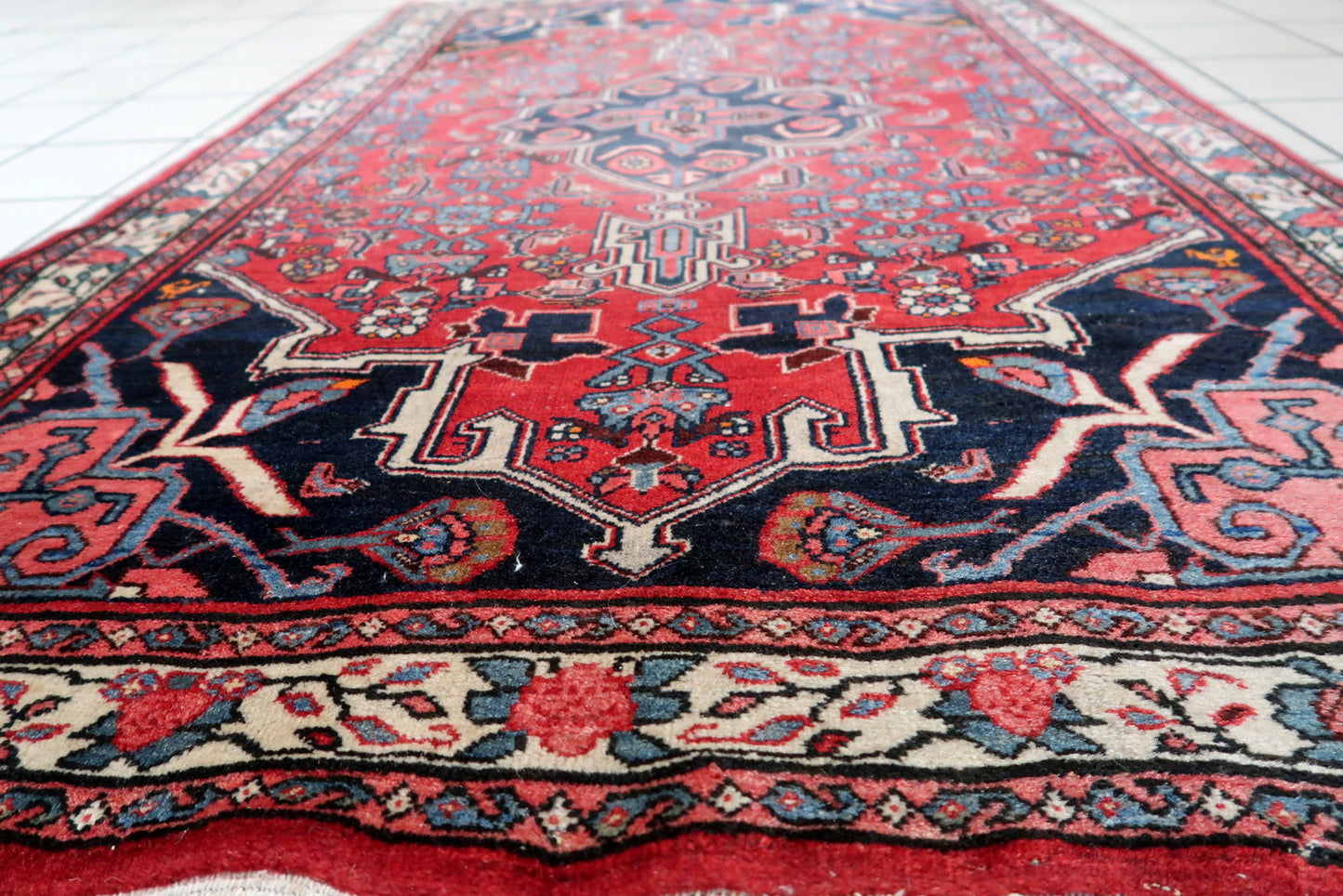 Close-up of warmth and vibrancy on Handmade Vintage Persian Bidjar Rug - Detailed view showcasing the warmth and vibrancy of the rug's color palette.