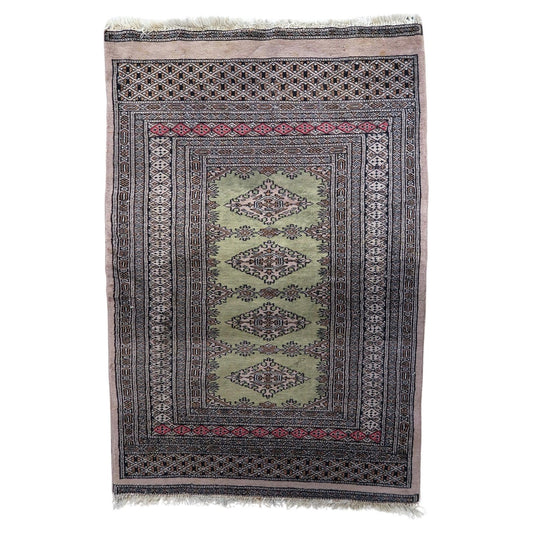 Vintage Uzbek Bukhara rug with red field and gul motifs

